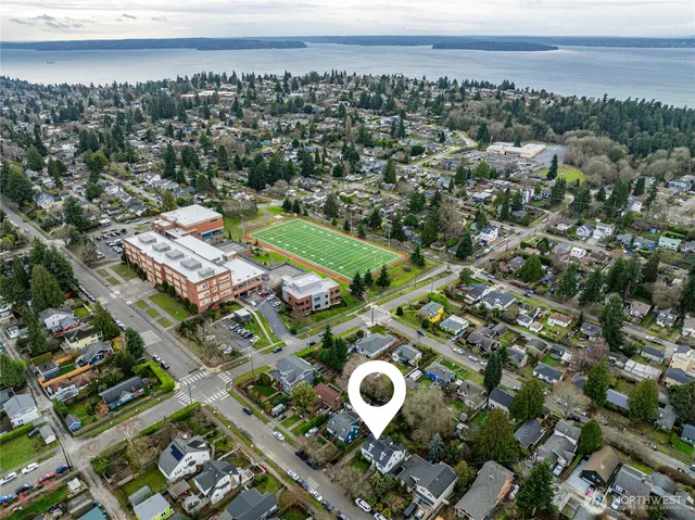 an aerial view of multiple house with yard
