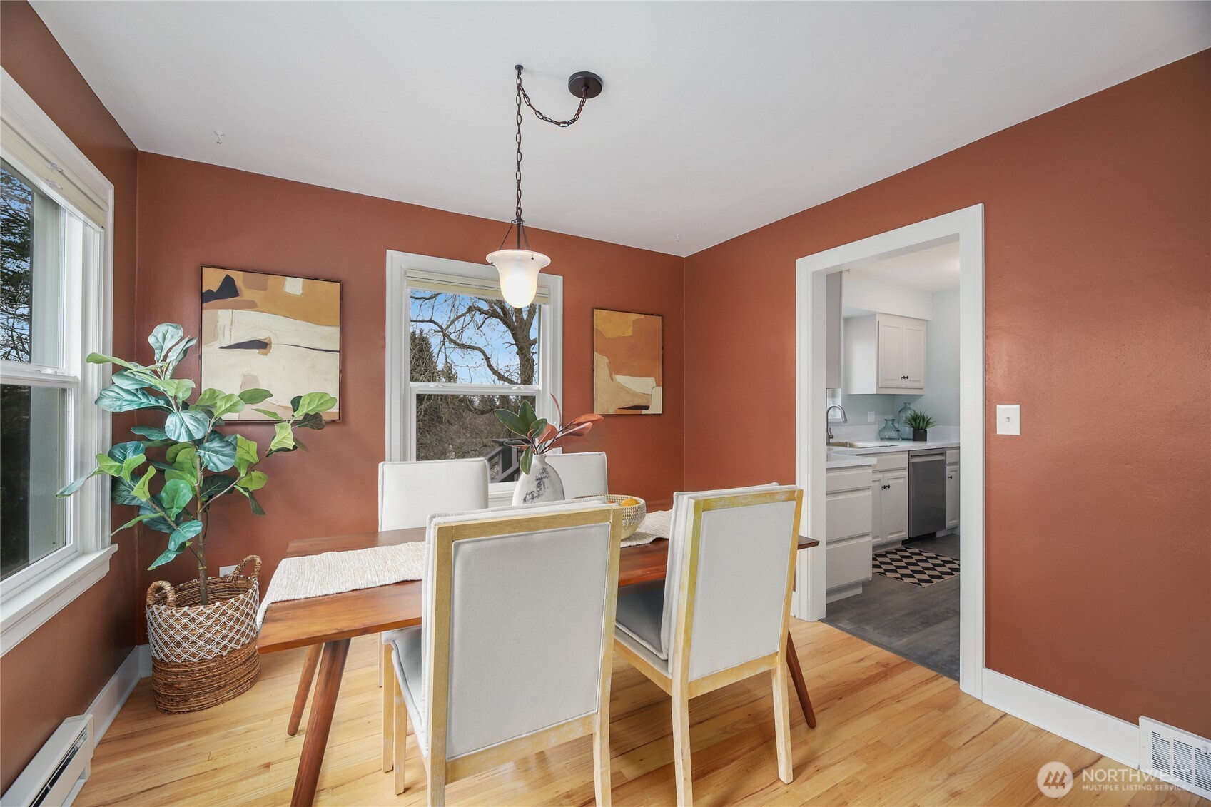 3239 45th Avenue Southwest Seattle, WA 98116 - Photo 7 of 39 a dining room with furniture a chandelier and wooden floor