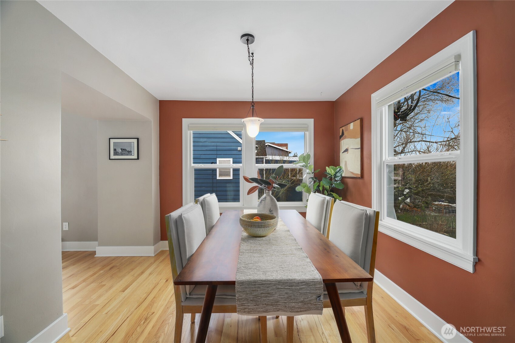 3239 45th Avenue Southwest Seattle, WA 98116 - Photo 9 of 39 a dining room with furniture a chandelier and wooden floor