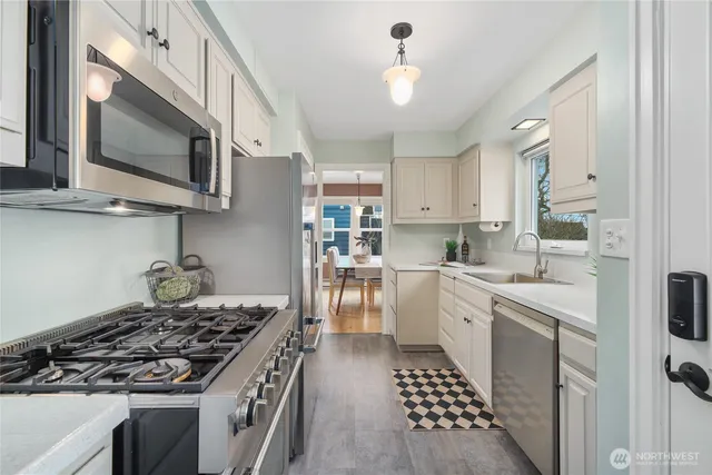 a kitchen with a stove and a microwave