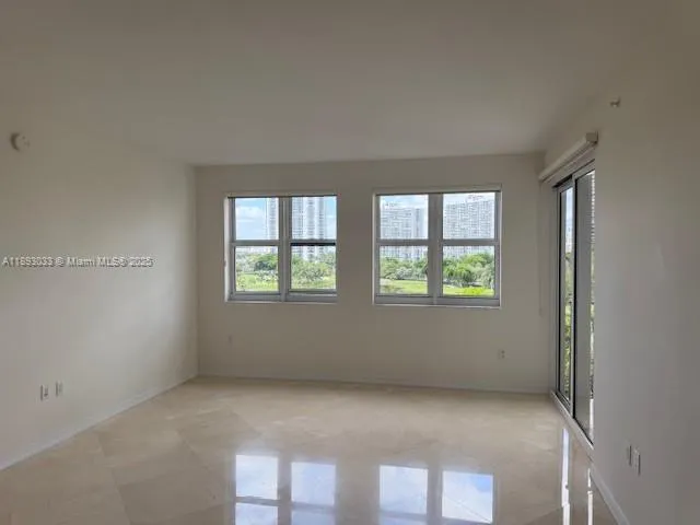 a view of a room that has a large window