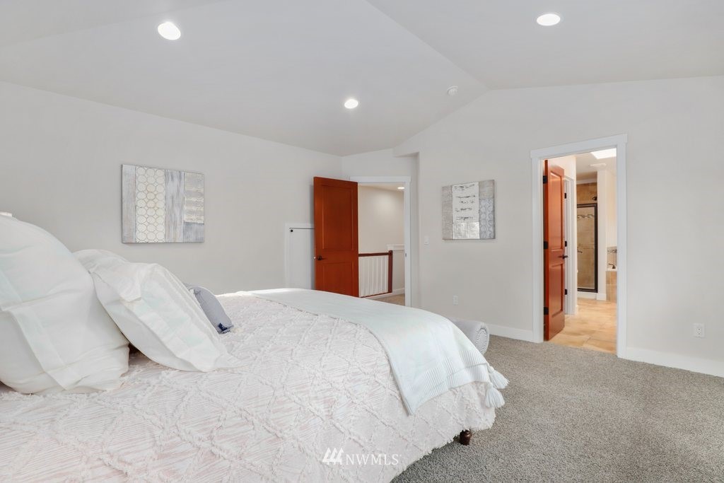 113 233rd Place Southeast Bothell, WA 98021 - Photo 21 of 39 a spacious bedroom with a bed and a lamp
