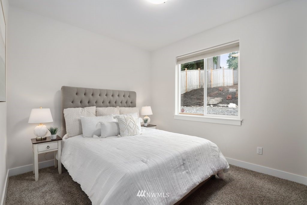 113 233rd Place Southeast Bothell, WA 98021 - Photo 24 of 39 a bedroom with a bed and window