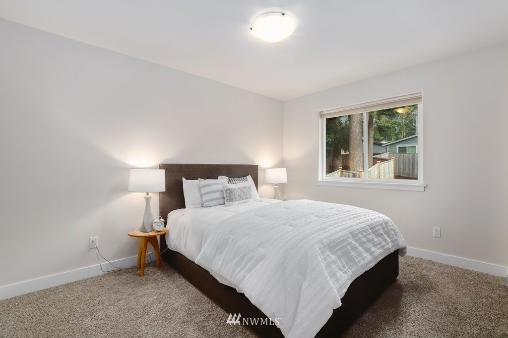 113 233rd Place Southeast Bothell, WA 98021 - Photo 26 of 39 a bedroom with a bed and window