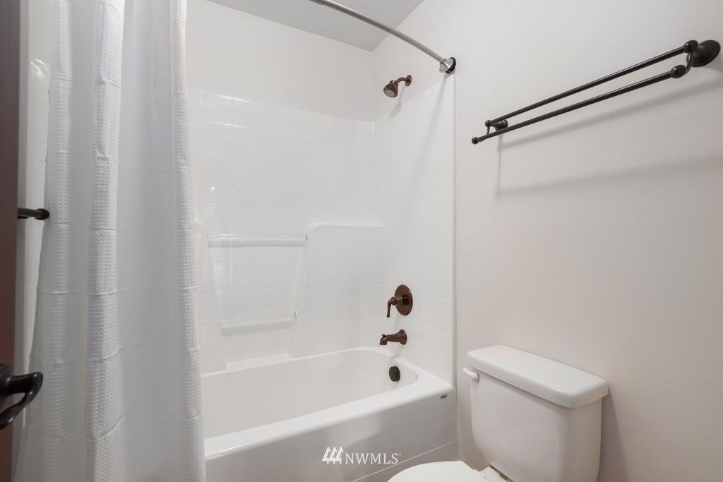 113 233rd Place Southeast Bothell, WA 98021 - Photo 27 of 39 a bathroom with a bathtub and a toilet