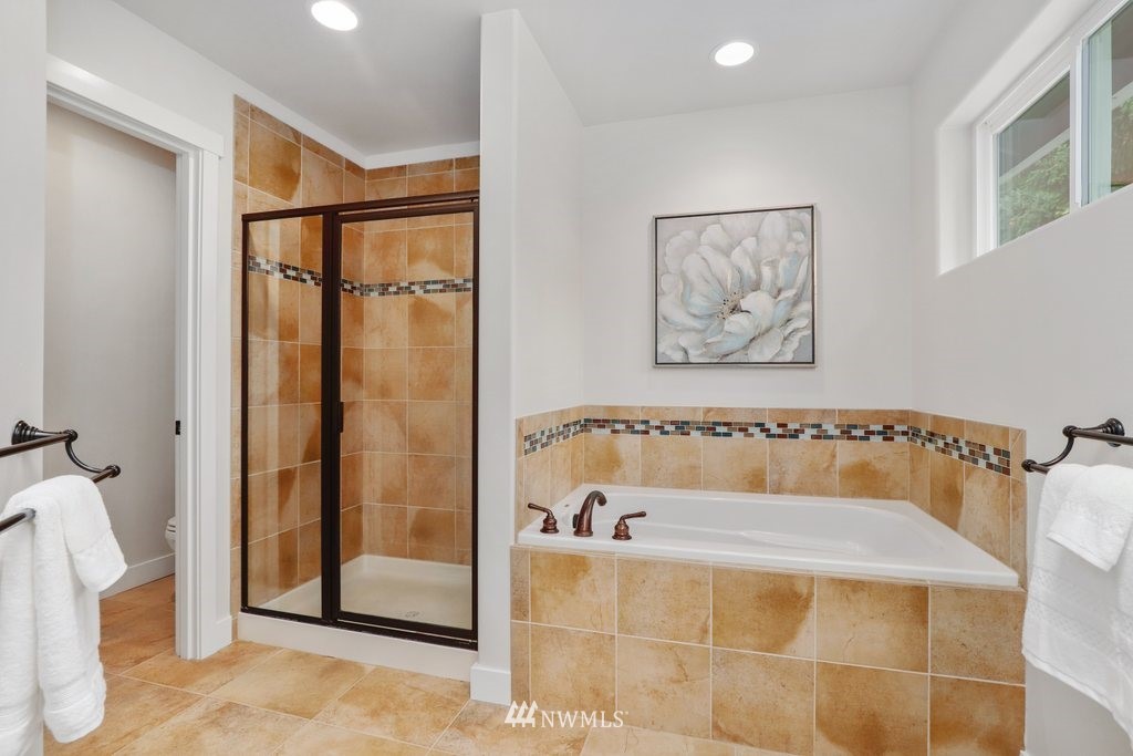 113 233rd Place Southeast Bothell, WA 98021 - Photo 29 of 39 a bathroom with a bathtub and a shower