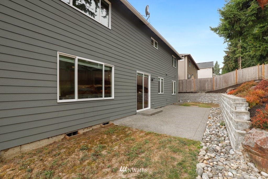 113 233rd Place Southeast Bothell, WA 98021 - Photo 31 of 39 a view of a house with a backyard