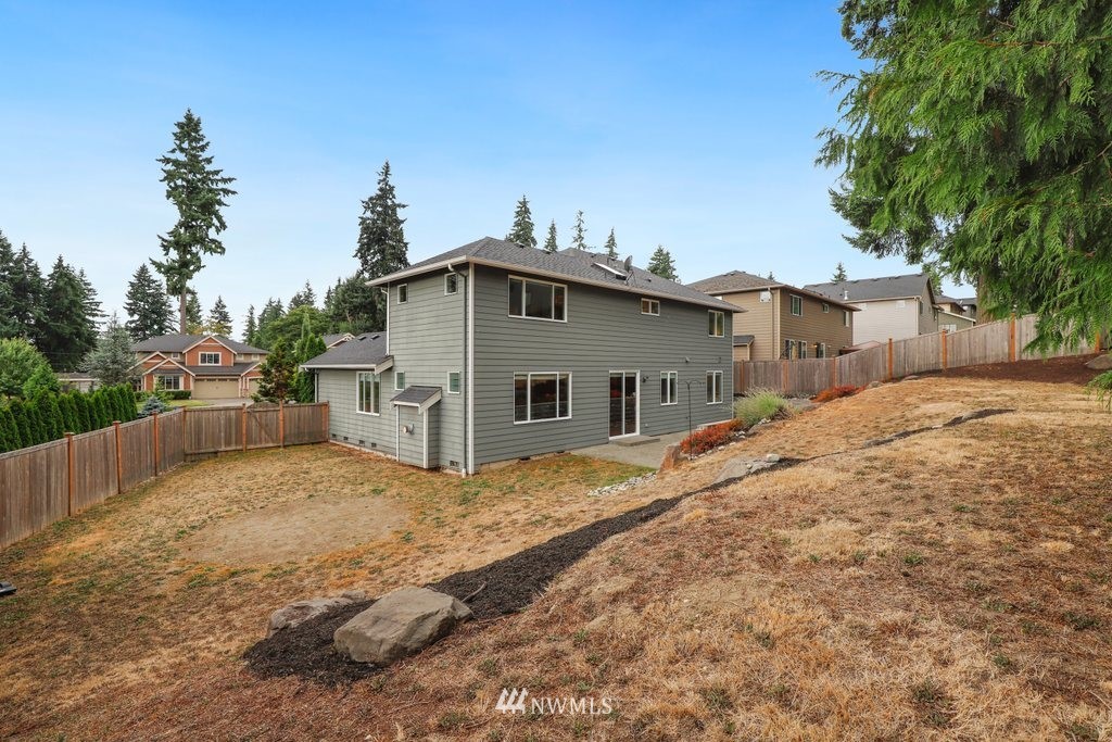 113 233rd Place Southeast Bothell, WA 98021 - Photo 33 of 39 a view of a house with a yard