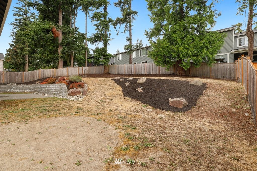 113 233rd Place Southeast Bothell, WA 98021 - Photo 34 of 39 a view of a backyard with a tree