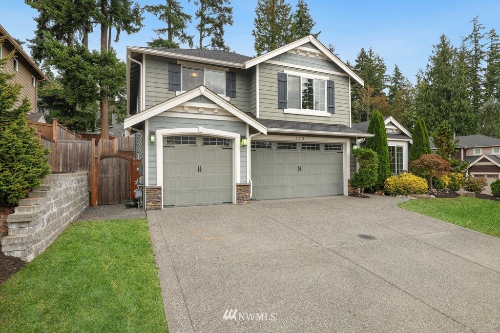 113 233rd Place Southeast Bothell, WA 98021 - Photo 38 of 39 a view of a house with a yard and large tree