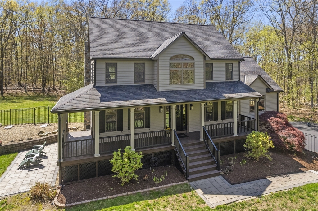 52 Fales Road Plainville, MA 02762 - Photo 1 of 41 a front view of a house with garden