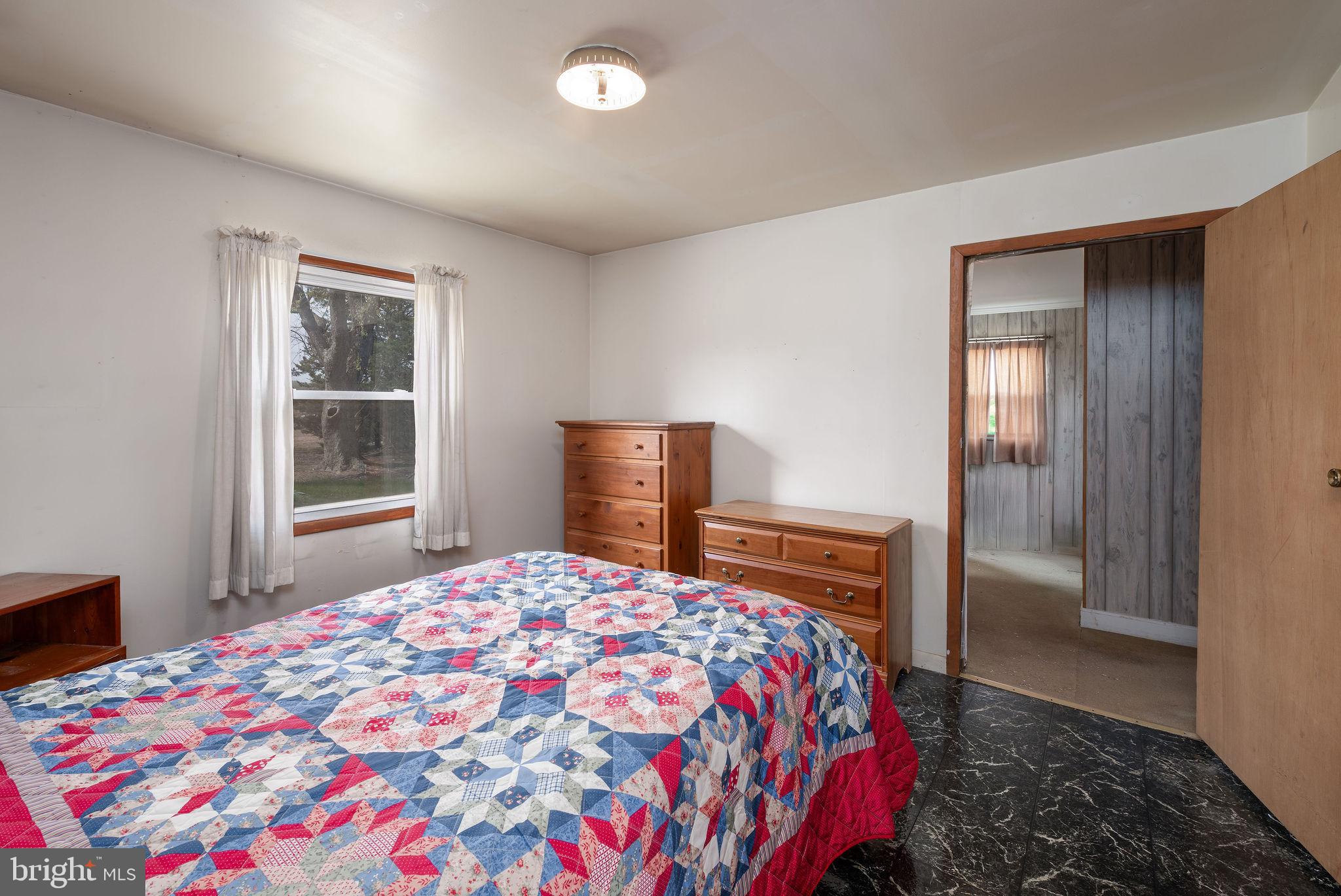 29618 Armory Road Dagsboro, DE 19939 - Photo 23 of 37 a bedroom with a bed and a window