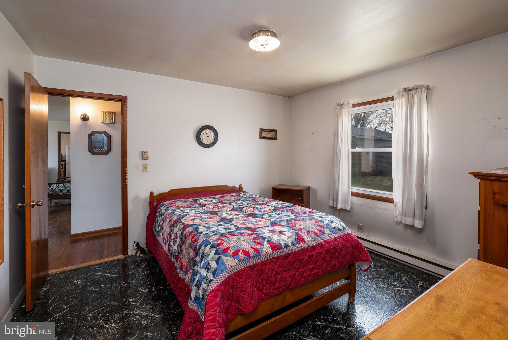 29618 Armory Road Dagsboro, DE 19939 - Photo 24 of 37 a bedroom with a bed and a window
