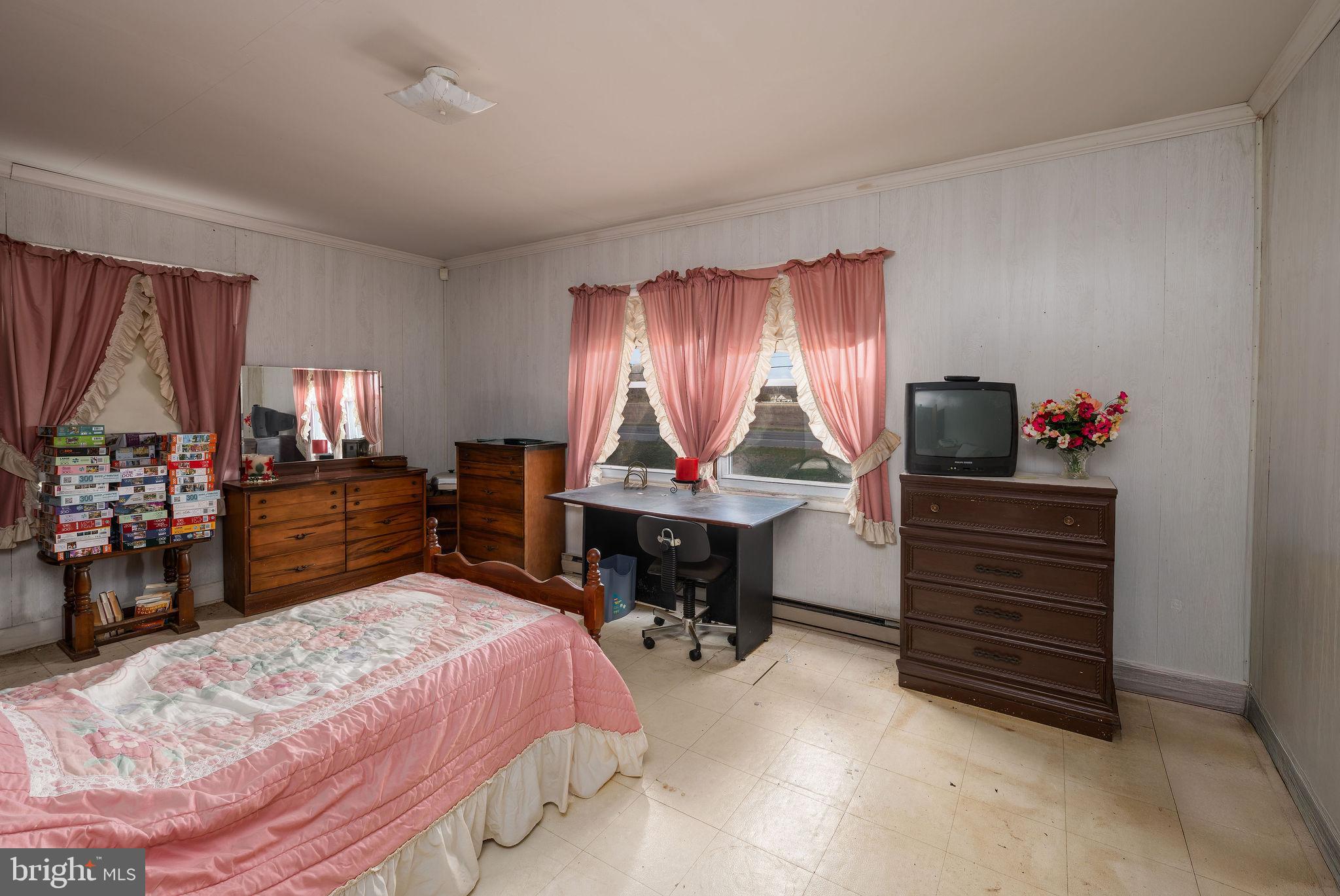 29618 Armory Road Dagsboro, DE 19939 - Photo 25 of 37 a bed room with a bed and a television