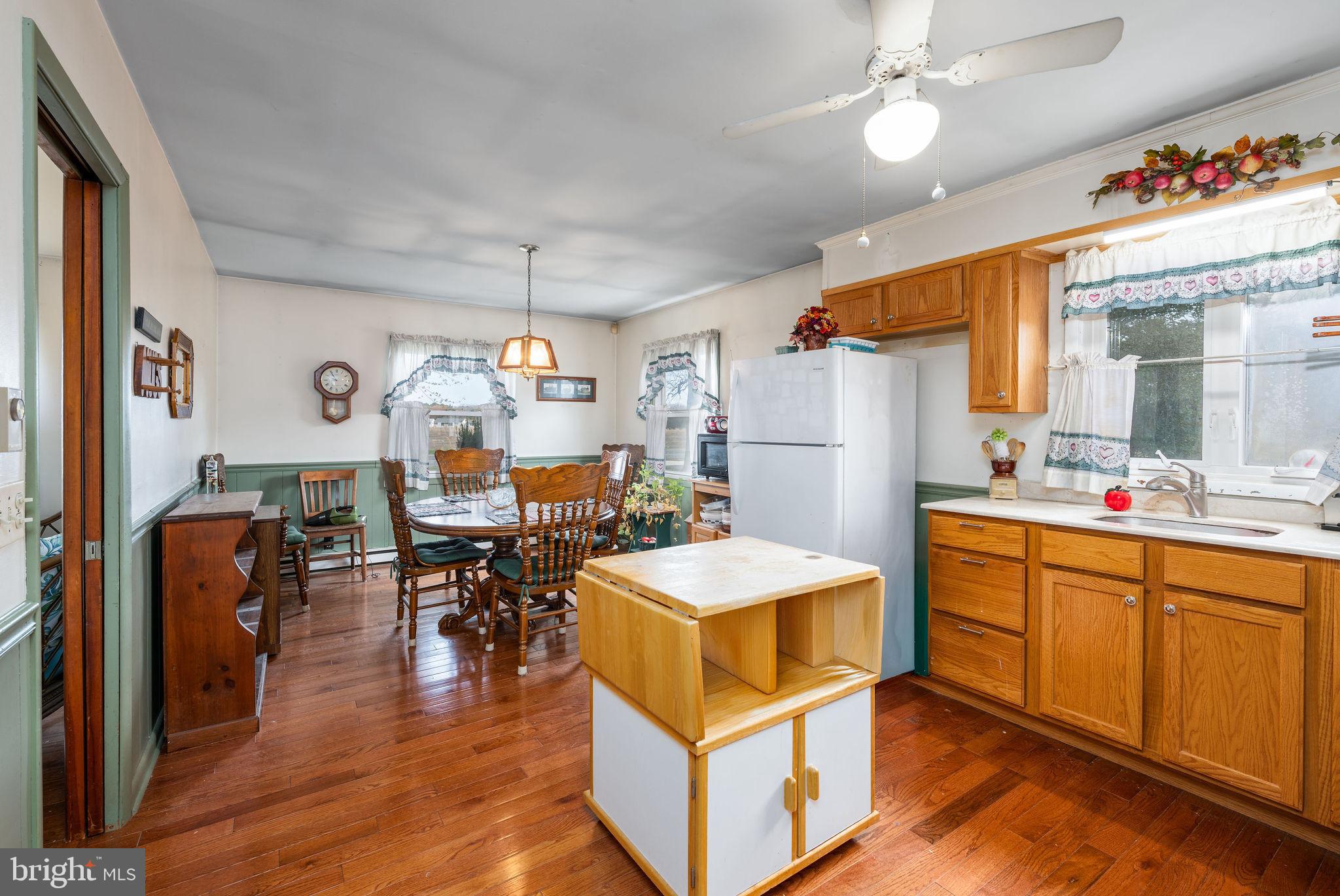 29618 Armory Road Dagsboro, DE 19939 - Photo 10 of 37 a large kitchen with a table and chairs