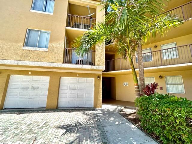 741 North Pine Island Road, Unit 303 Plantation, FL 33324 - Photo 3 of 32 a view of entrance gate of the building