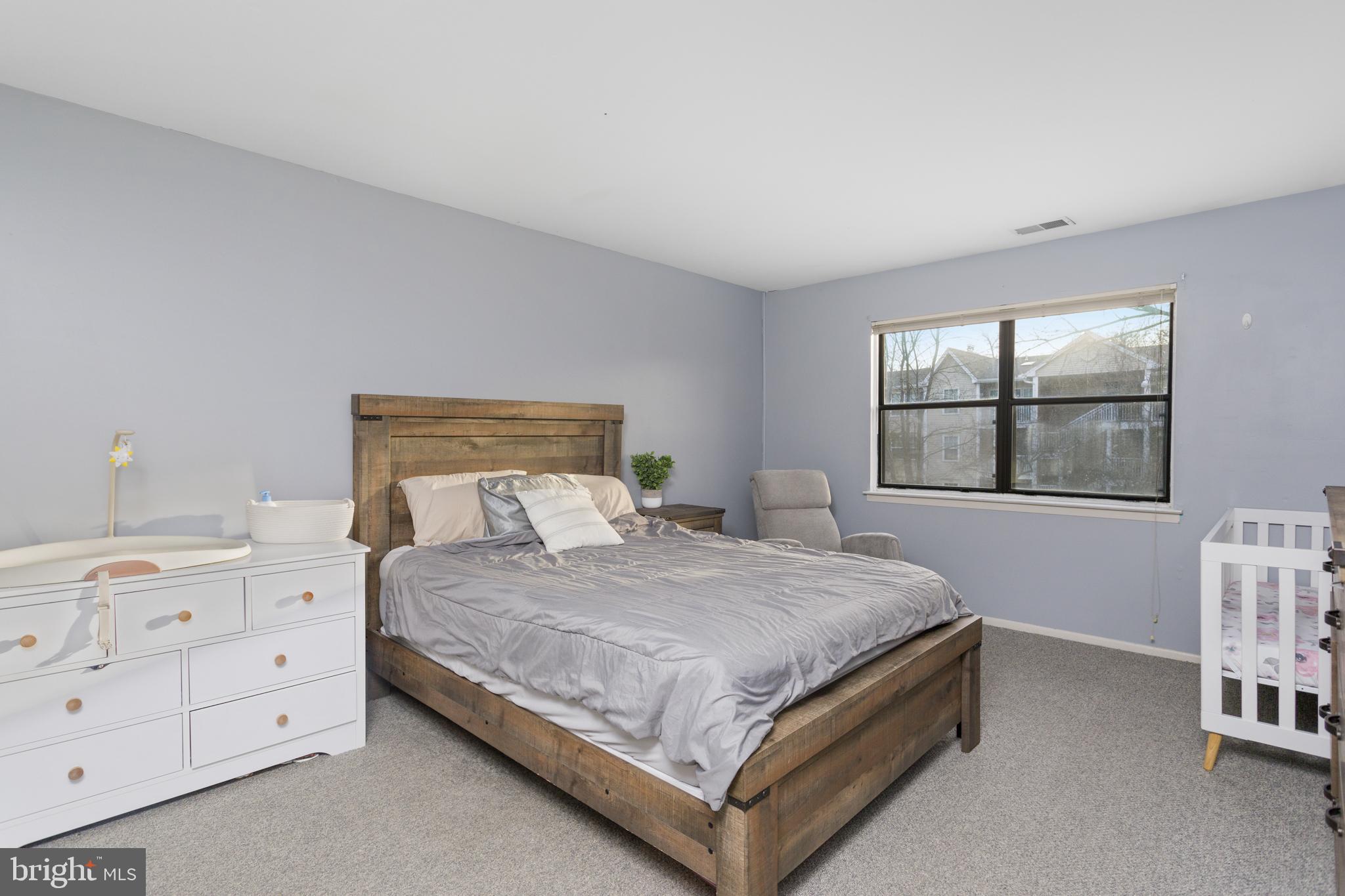 912 Silver Court Hamilton, NJ 08690 - Photo 15 of 22 a bedroom with a bed and a window