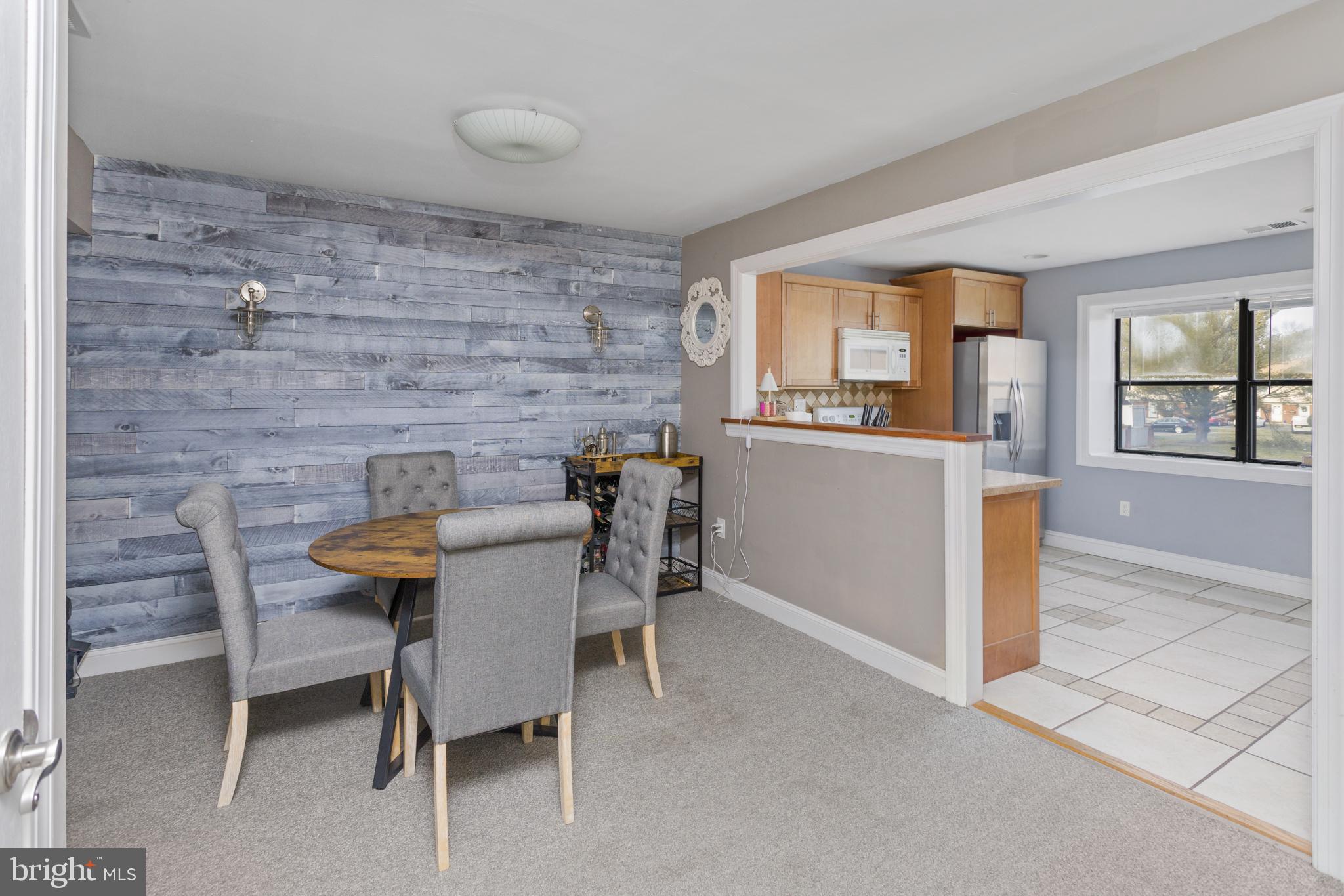 912 Silver Court Hamilton, NJ 08690 - Photo 8 of 22 a view of a dining room with furniture and a window