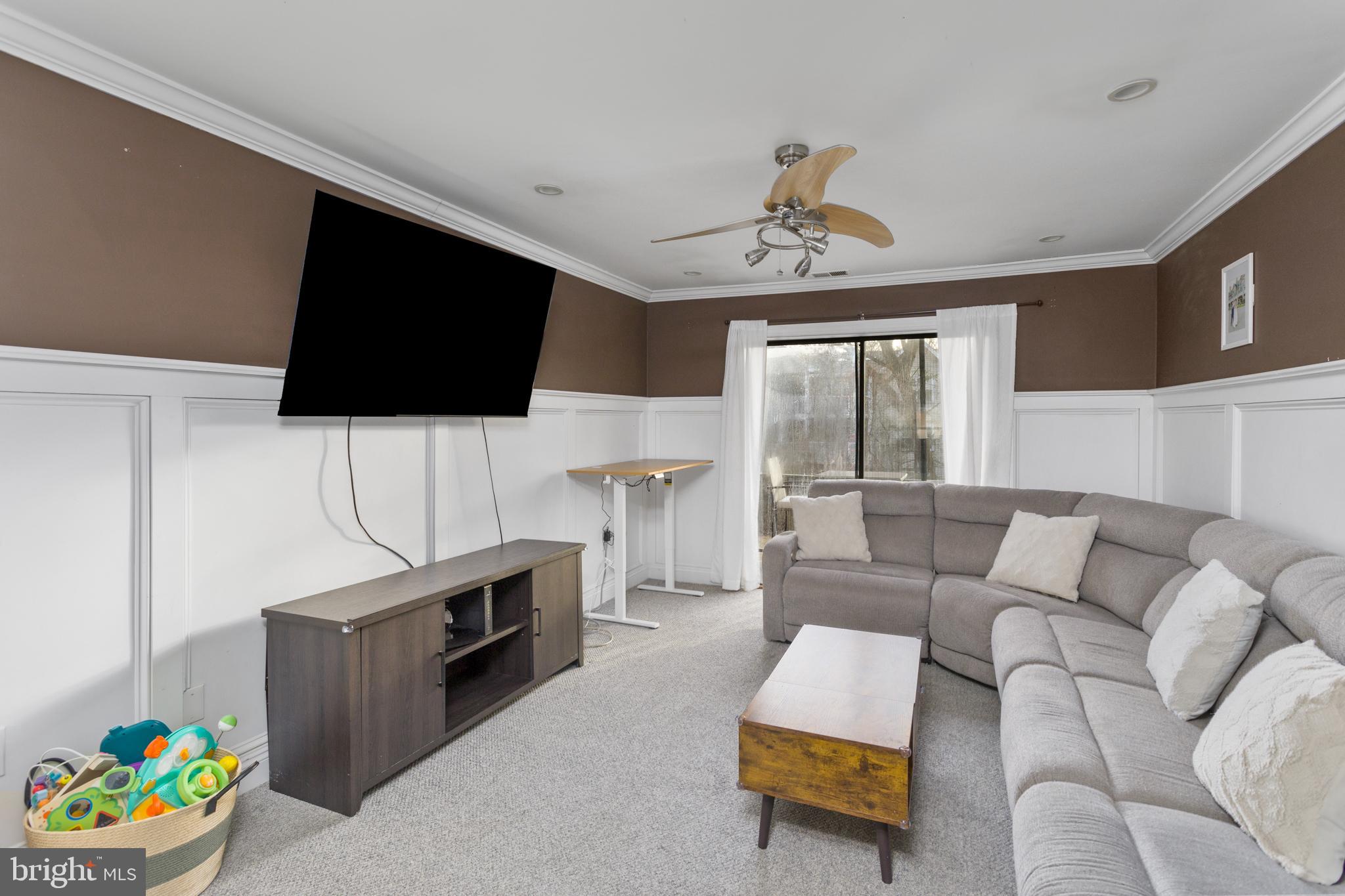 912 Silver Court Hamilton, NJ 08690 - Photo 10 of 22 a living room with furniture and a flat screen tv
