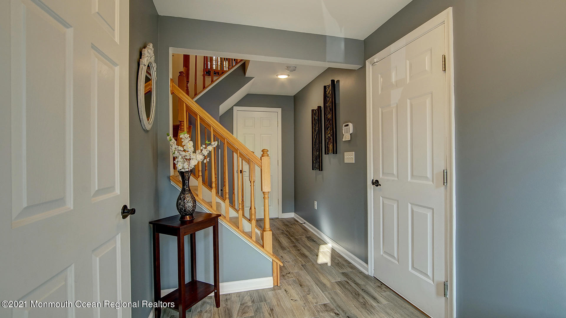 5 Abby Road Farmingdale, NJ 07727 - Photo 2 of 18 a view of a hallway with wooden floor and entryway