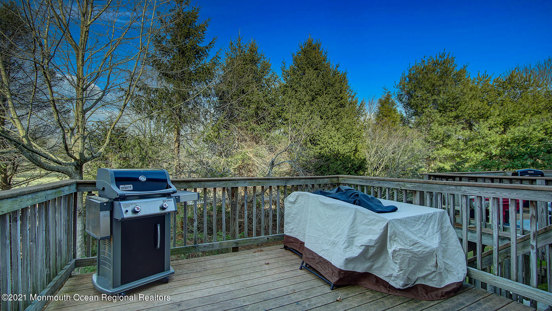 5 Abby Road Farmingdale, NJ 07727 - Photo 16 of 18 a balcony with wooden floor and fence