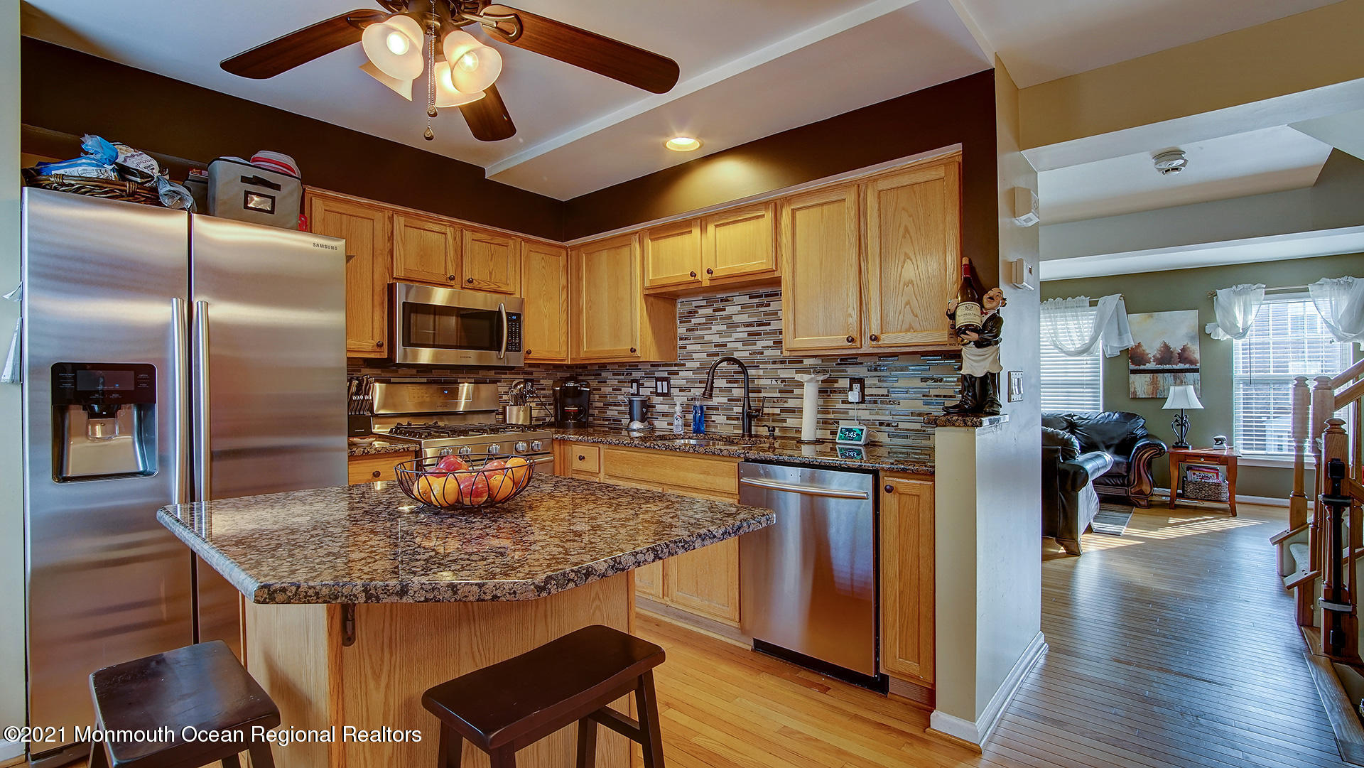 5 Abby Road Farmingdale, NJ 07727 - Photo 4 of 18 a kitchen with stainless steel appliances granite countertop a sink a stove and a refrigerator