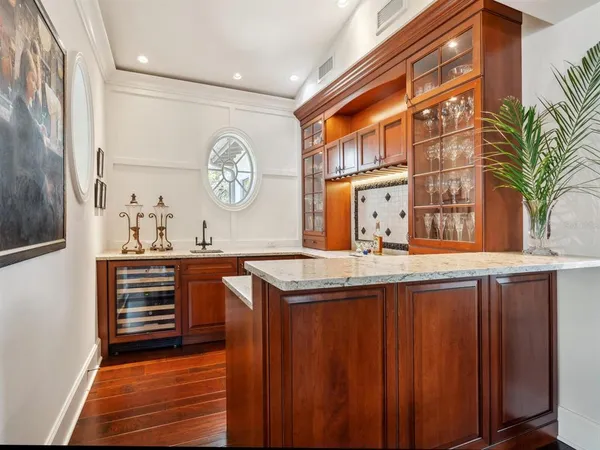 a bedroom with a bed dresser and a window