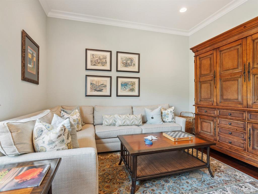 7333 Point Of Rocks Road Sarasota, FL 34242 - Photo 21 of 81 a living room with furniture a rug and a window