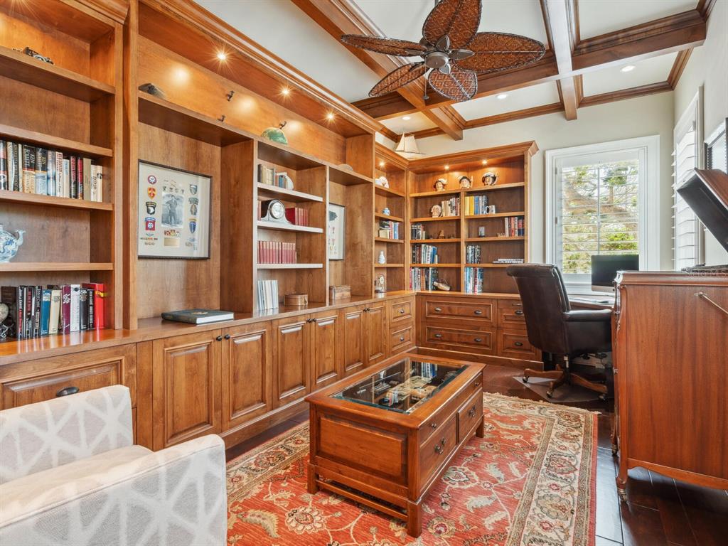 7333 Point Of Rocks Road Sarasota, FL 34242 - Photo 22 of 81 a reading room with furniture and a book shelf