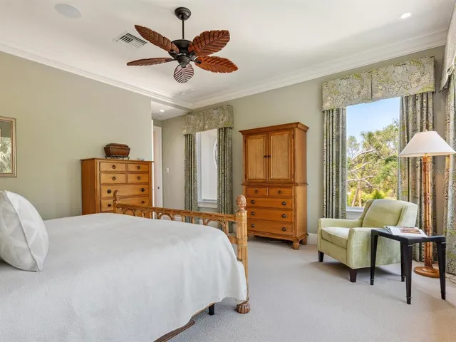 a view of a dining room with furniture and a window