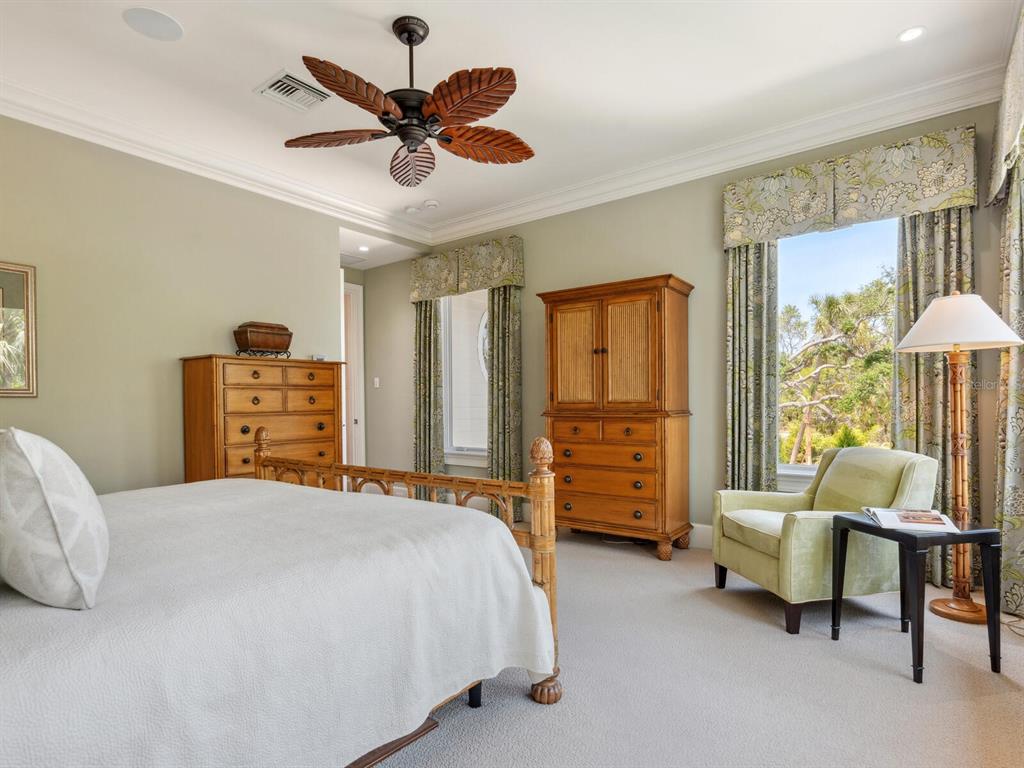 7333 Point Of Rocks Road Sarasota, FL 34242 - Photo 25 of 81 a bedroom with a bed dresser and a window