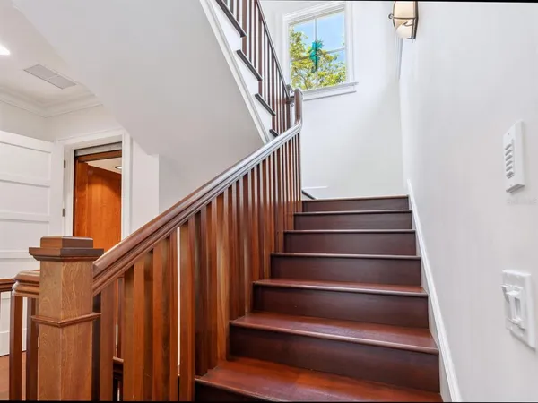 a view of an entryway with wooden floor