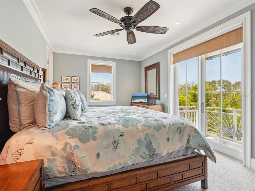 7333 Point Of Rocks Road Sarasota, FL 34242 - Photo 31 of 81 a bed sitting in a bedroom next to a window