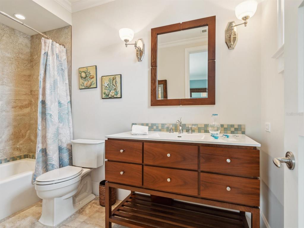 7333 Point Of Rocks Road Sarasota, FL 34242 - Photo 33 of 81 a bathroom with a toilet a sink and mirror