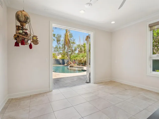 a living room with furniture wooden floor and a large window