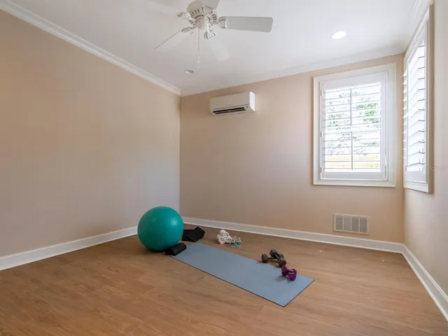 a kitchen with stainless steel appliances granite countertop a kitchen island a stove a table and chairs in it
