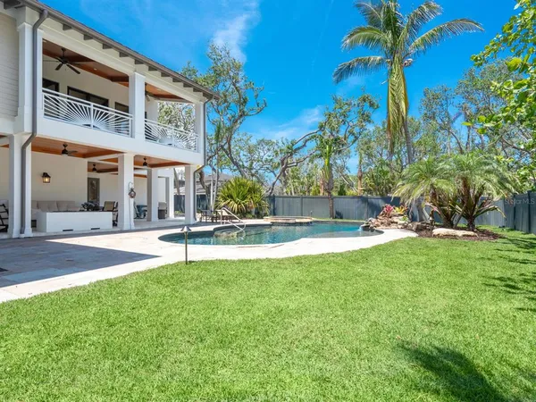a view of a swimming pool with a backyard