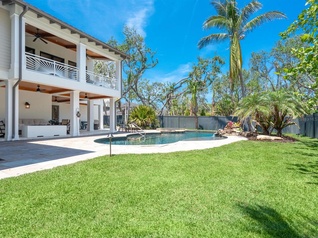 7333 Point Of Rocks Road Sarasota, FL 34242 - Photo 43 of 81 a view of a building with a swimming pool