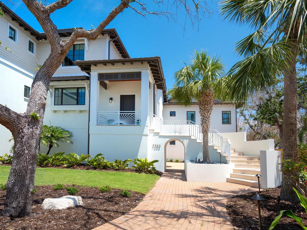 7333 Point Of Rocks Road Sarasota, FL 34242 - Photo 51 of 81 a front view of a house with a garden
