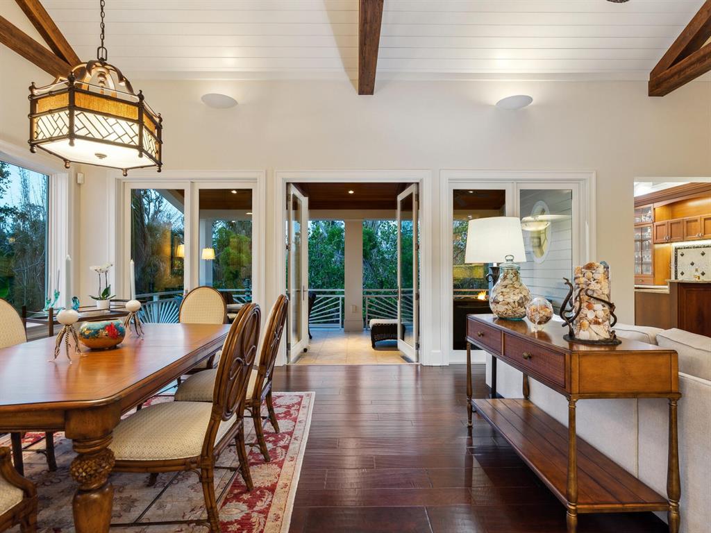 7333 Point Of Rocks Road Sarasota, FL 34242 - Photo 64 of 81 a view of a dining room with furniture window and wooden floor