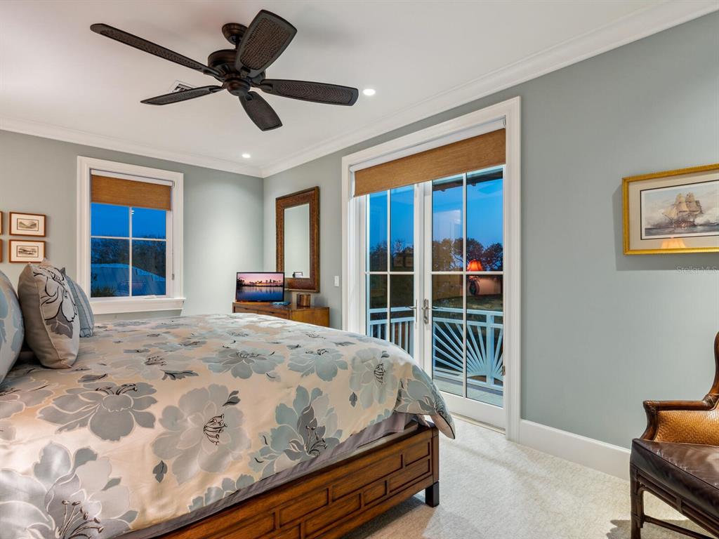 7333 Point Of Rocks Road Sarasota, FL 34242 - Photo 72 of 81 a bedroom with a bed and a large window