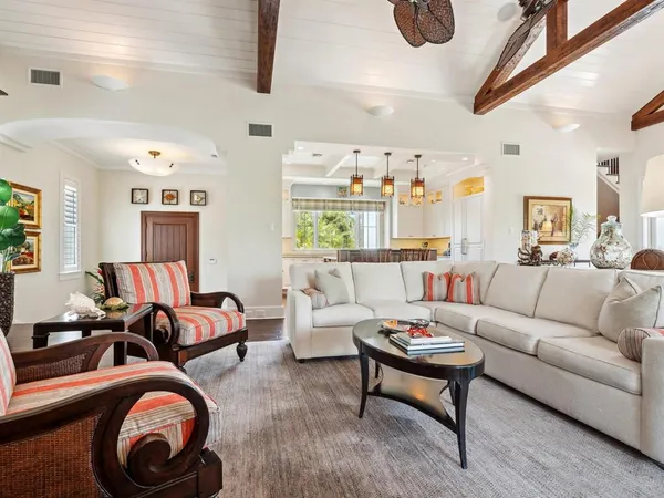 a view of a dining room with furniture wooden floor and chandelier