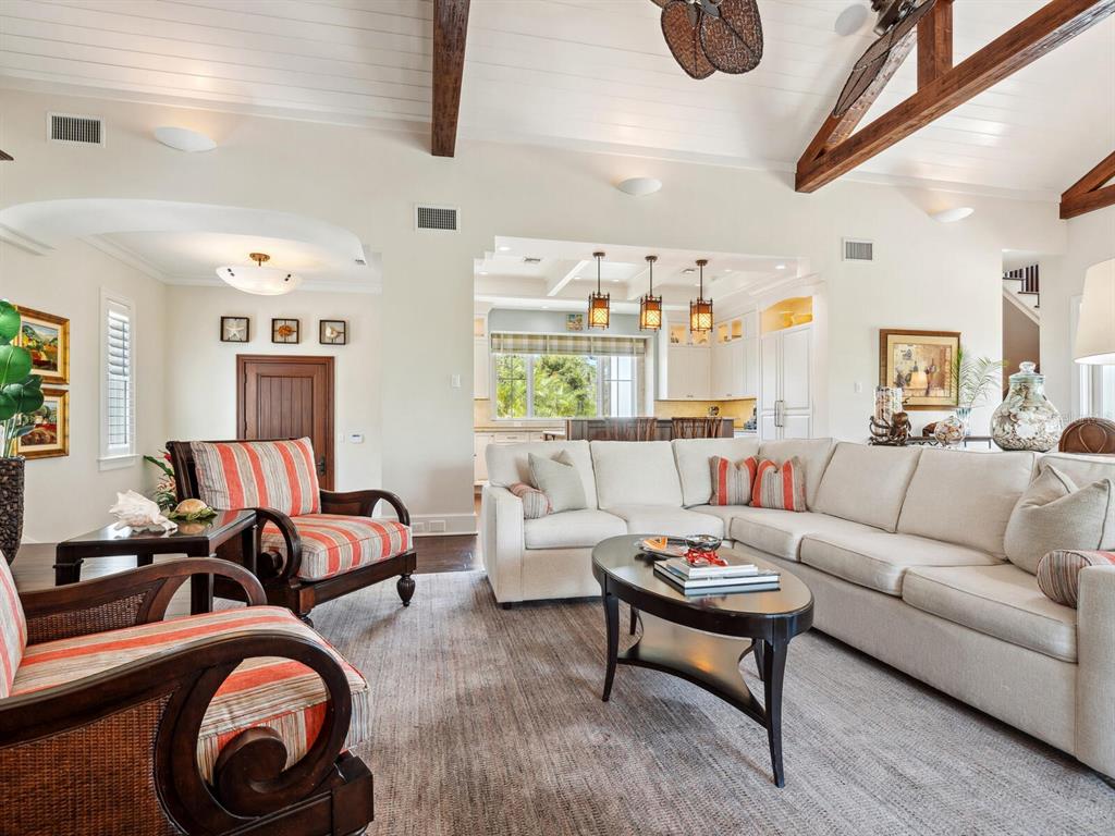 7333 Point Of Rocks Road Sarasota, FL 34242 - Photo 9 of 81 a living room with furniture a rug and a large window