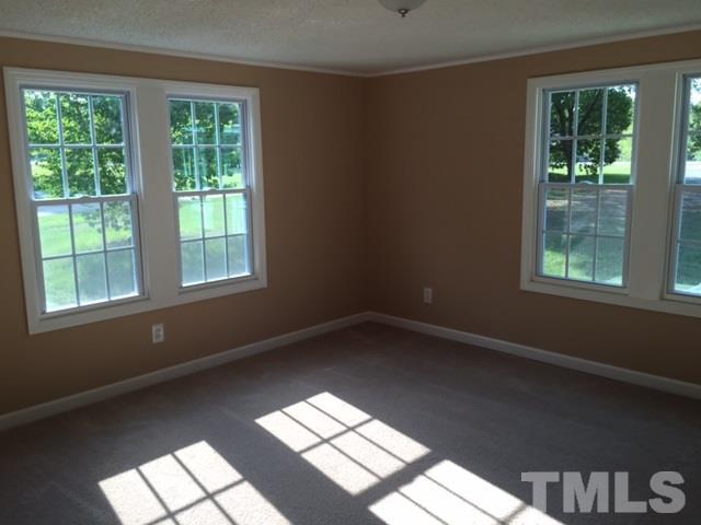 1390 Langdon Road Angier, NC 27501 - Photo 11 of 24 a view of an empty room and window