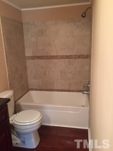 1390 Langdon Road Angier, NC 27501 - Photo 12 of 24 a bathroom with a toilet and a shower