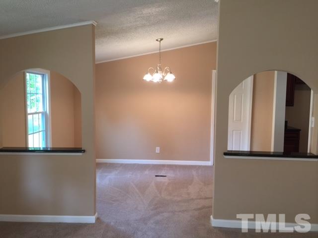1390 Langdon Road Angier, NC 27501 - Photo 3 of 24 a view of a hallway with windows
