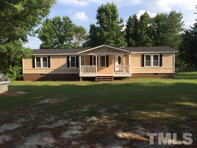 1390 Langdon Road Angier, NC 27501 - Photo 21 of 24 a front view of a house with a garden