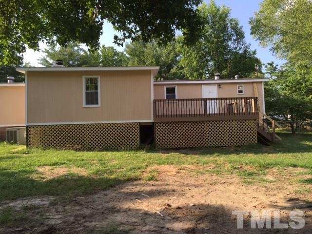 1390 Langdon Road Angier, NC 27501 - Photo 22 of 24 a view of a house with a bed