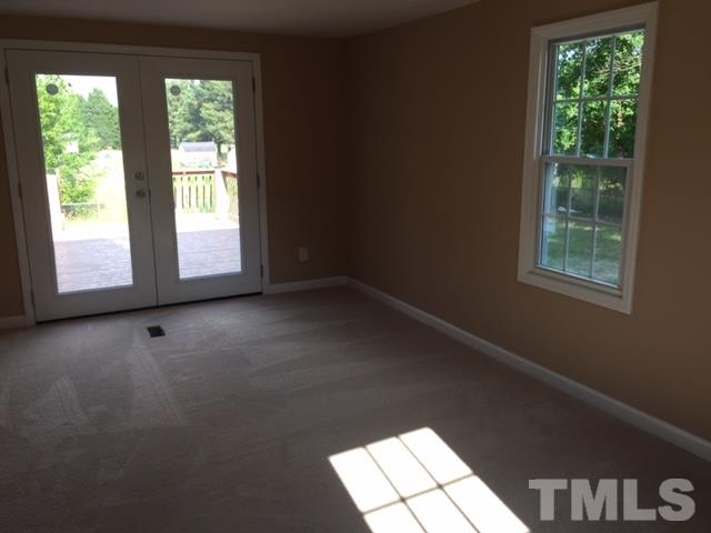 1390 Langdon Road Angier, NC 27501 - Photo 9 of 24 an empty room with a window