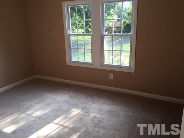 1390 Langdon Road Angier, NC 27501 - Photo 10 of 24 an empty room with a window